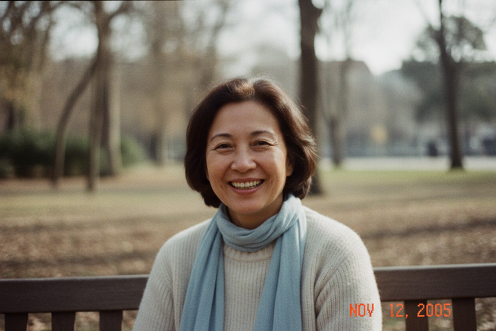 low quality picture of a woman smiling